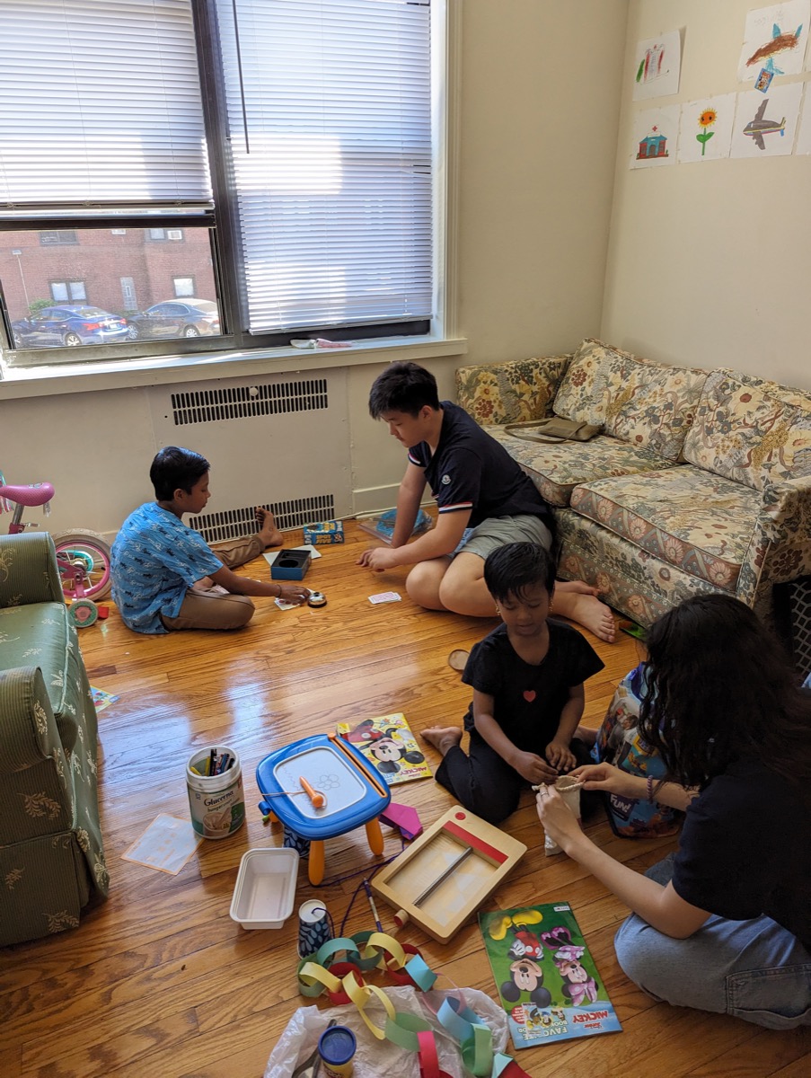 Volunteers and children playing together